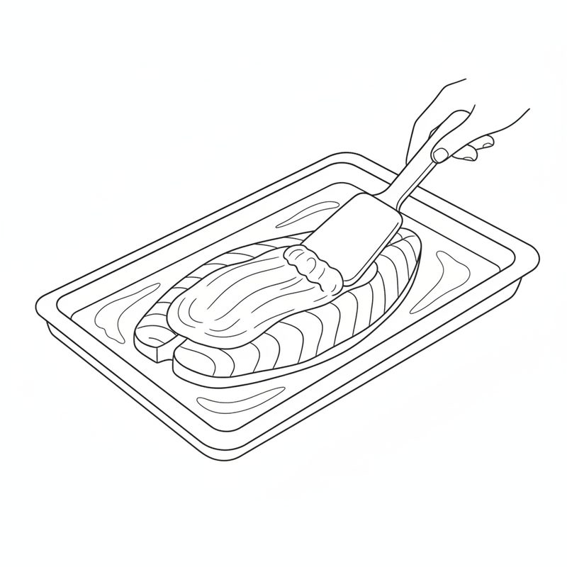 A hand using a spatula to spread a thick layer over a fish fillet lying on a rectangular baking tray