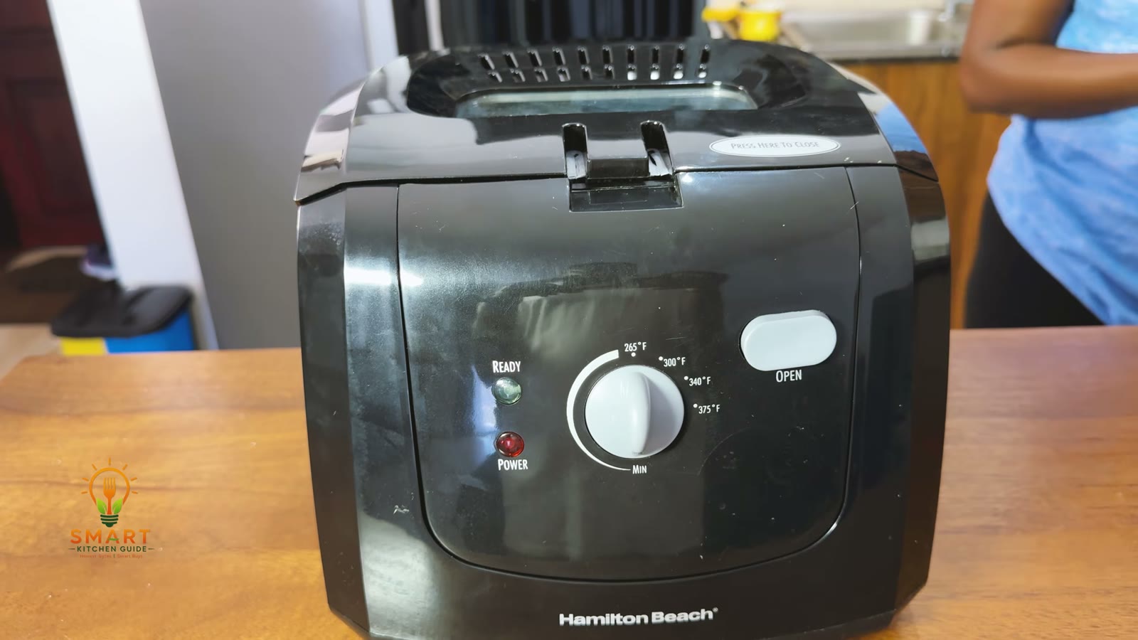 Front of the Hamilton Beach 35021 deep fryer with the temperature dial, READY and POWER lights and the OPEN button