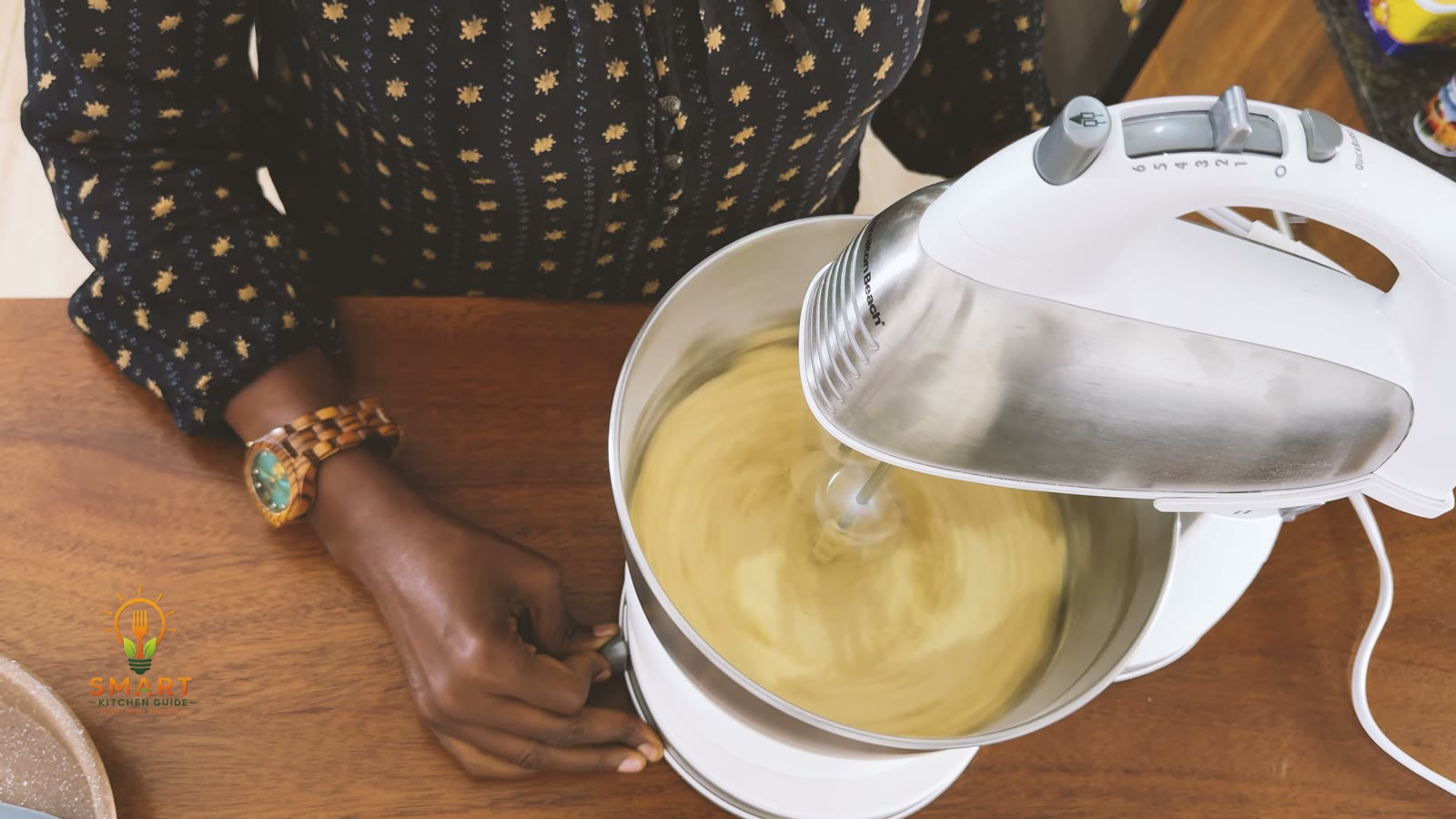 The Hamilton Beach 64655 mixing cookie dough in stand mode in its stainless steel bowl
