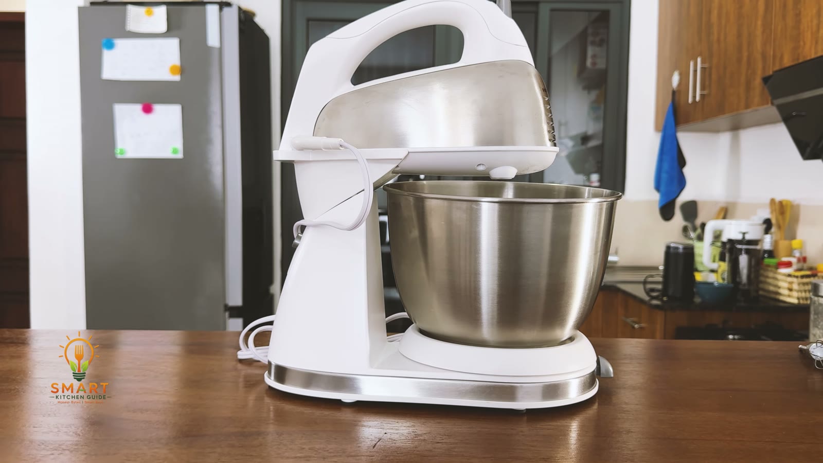 Front view of the Hamilton Beach 64655 stand and hand mixer with the 4-quart stainless steel bowl on its turntable
