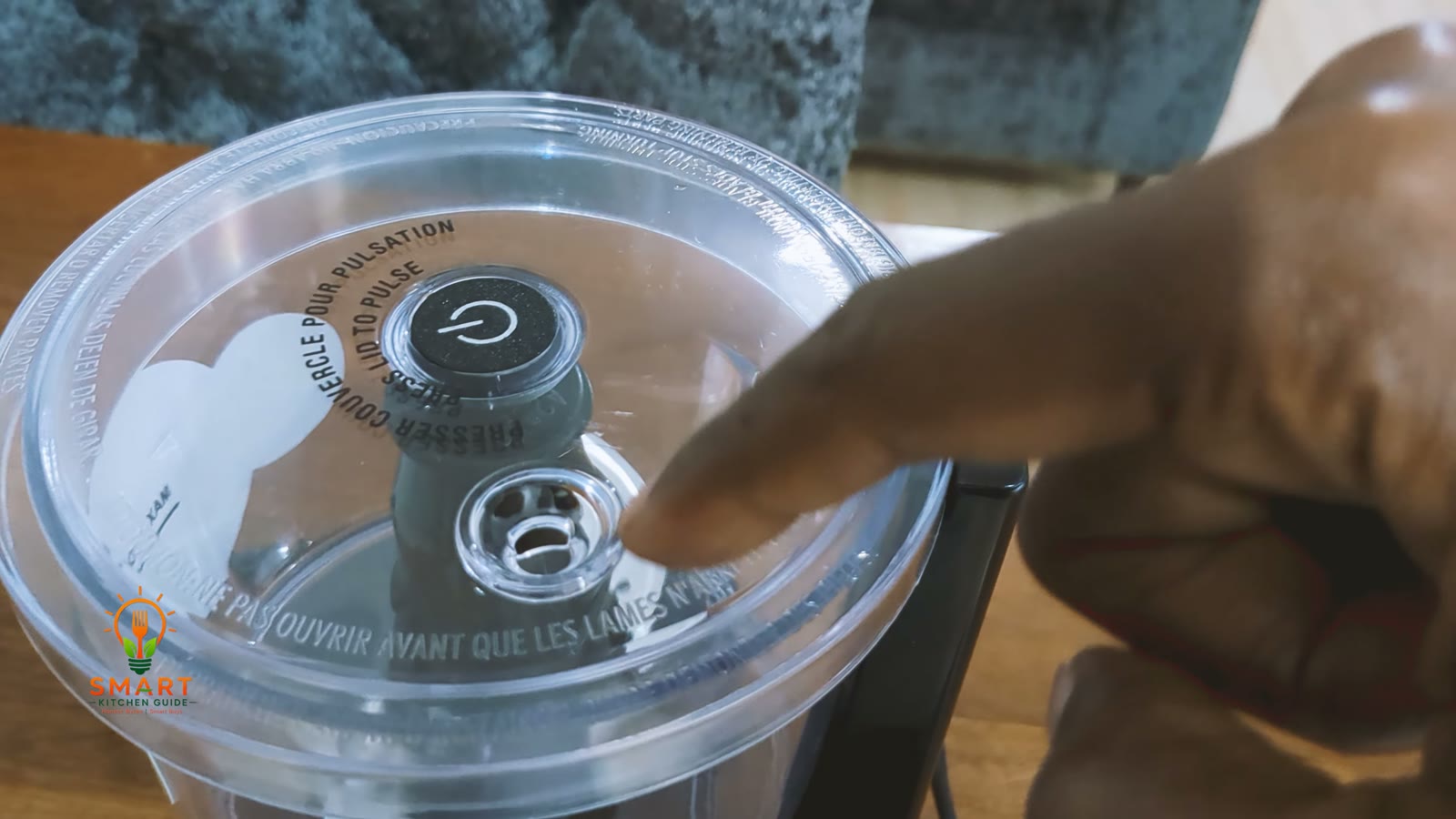 The lid of the Hamilton Beach Stack & Press 72850 with the press button and the oil dispenser hole