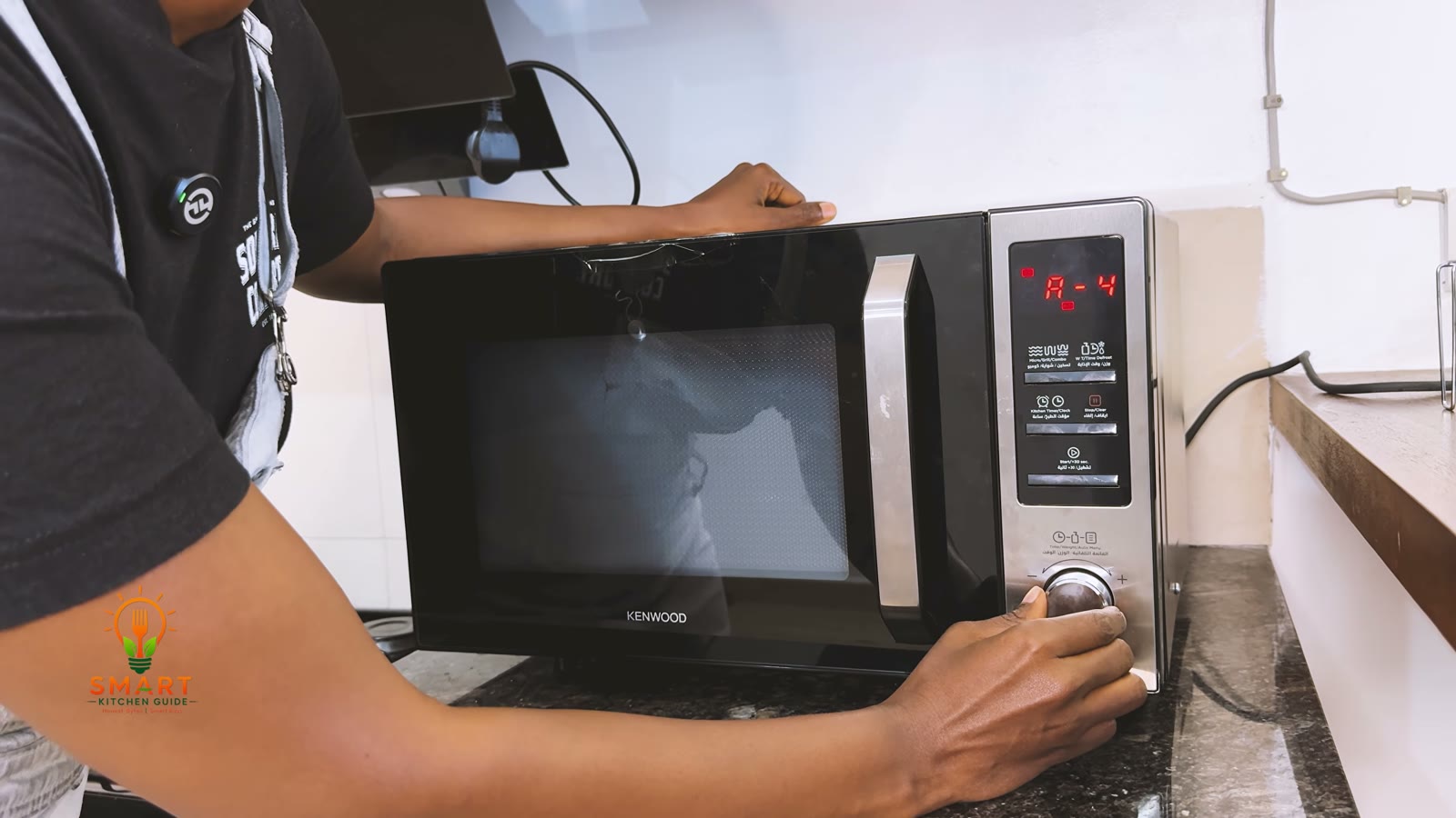 Turning the rotary dial on the Kenwood MWM25.000BK until the display shows auto menu A-4