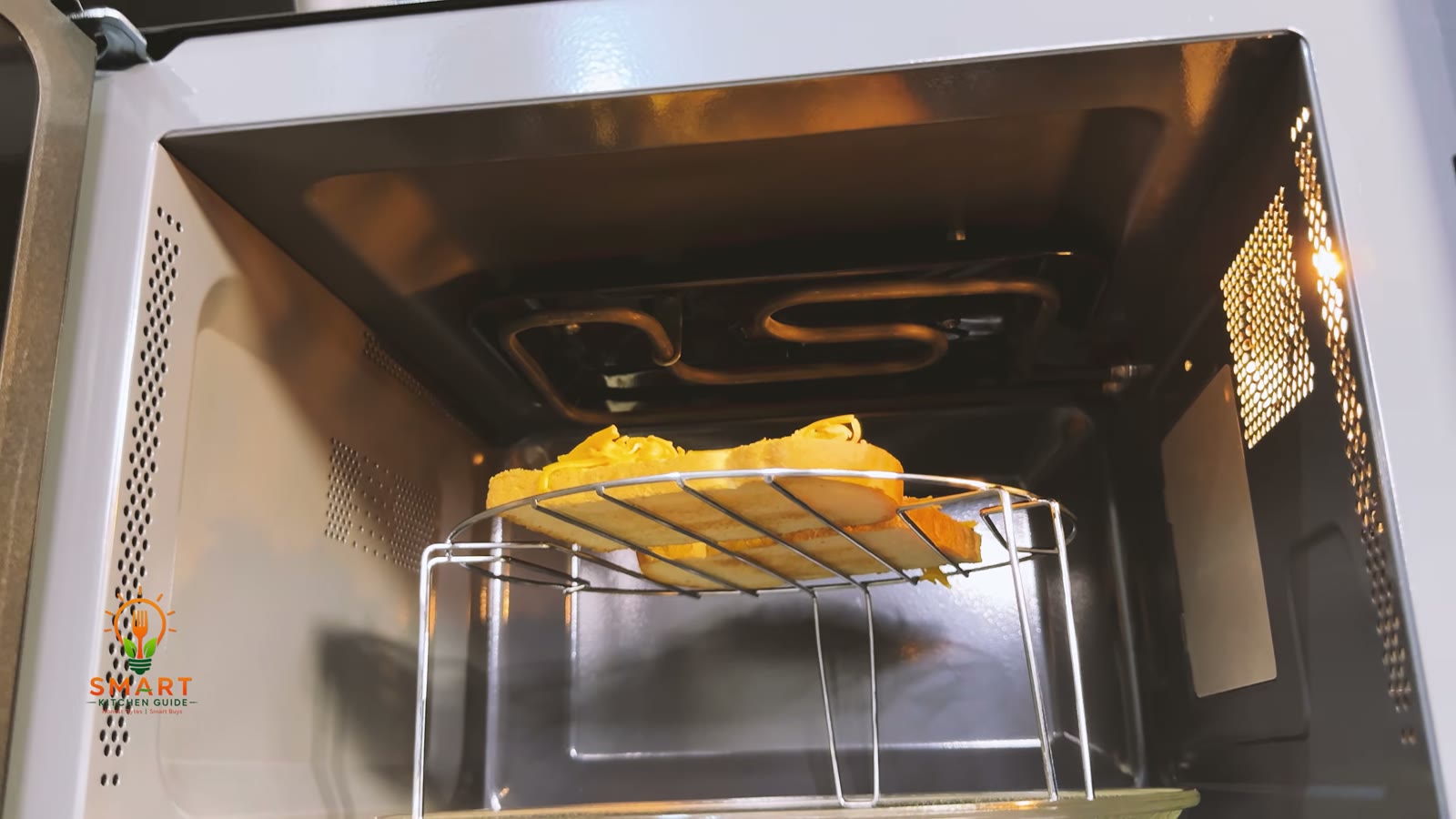 Cheese on toast on the metal rack under the grill element in the roof of the Kenwood MWM25.000BK during the grill test