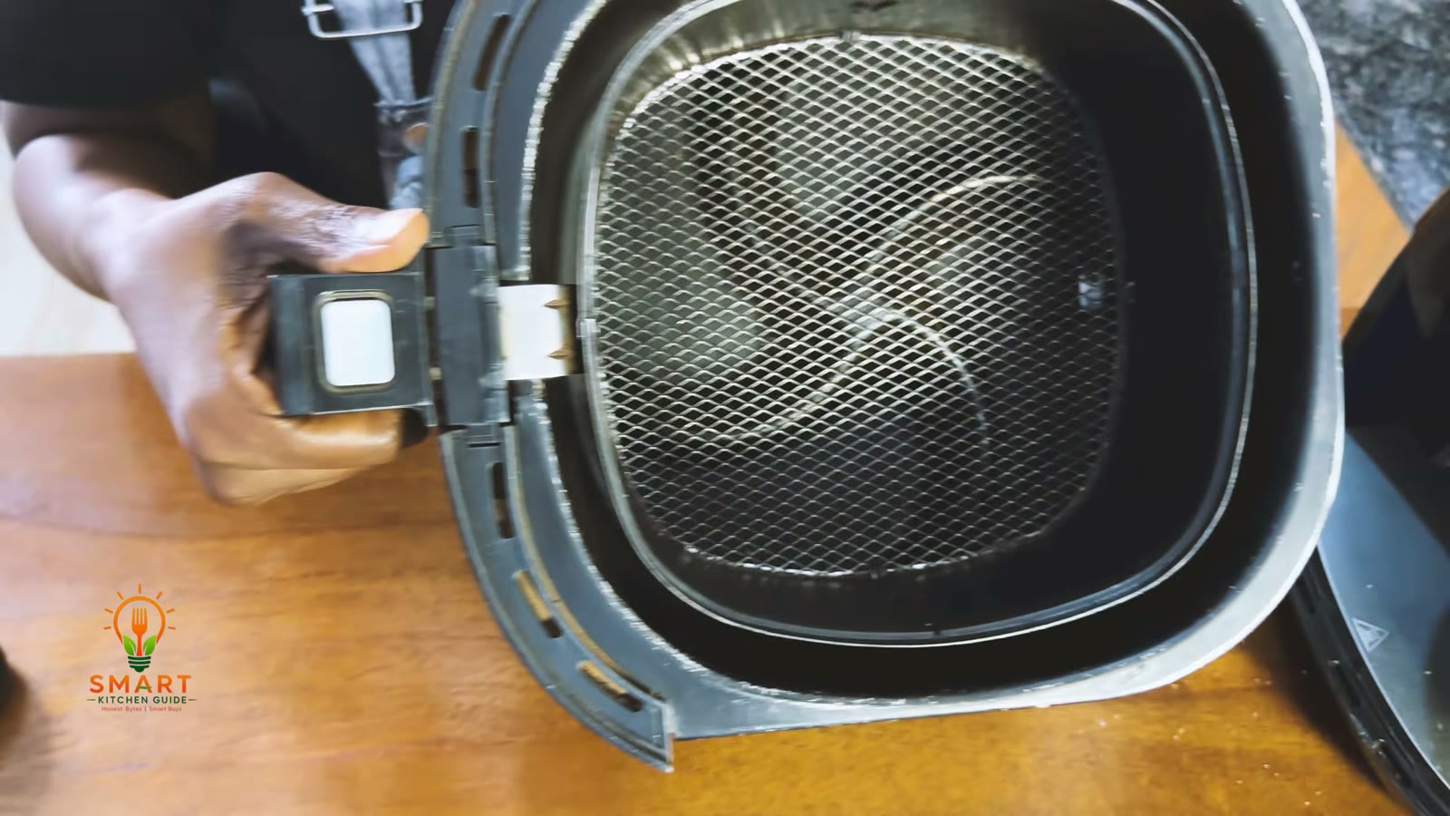 Pan and basket of the Philips Airfryer HD9220 pulled out for inspection, with light scuffing on the pan rim