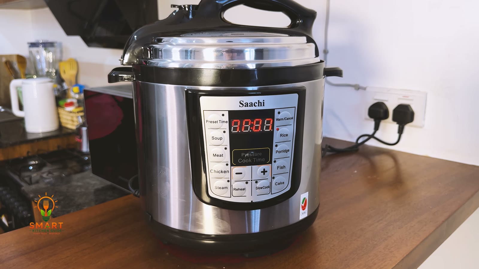 Saachi NL-PC-5306 with its lid sealed and the Rice programme light lit on the LED display