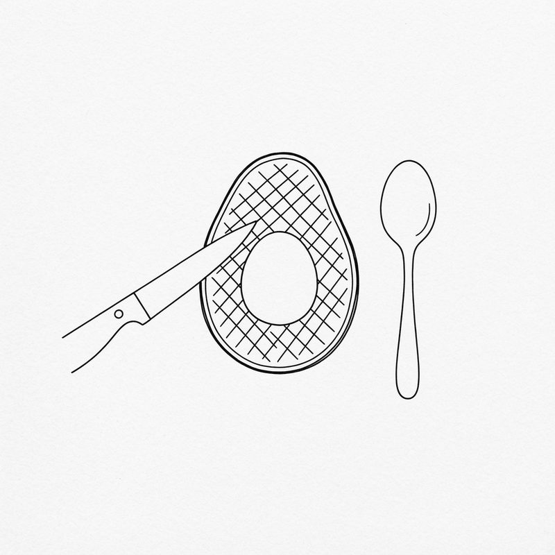 Line drawing of a knife tip scoring a cross-hatch pattern into an avocado half beside the empty stone hollow, a spoon lying next to it