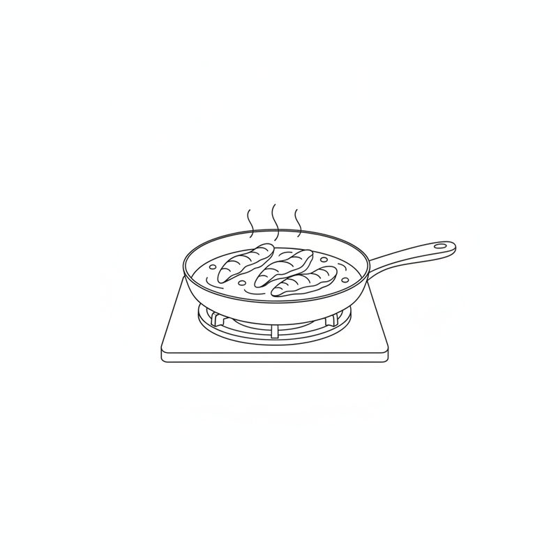 Three chicken strips frying in oil in a pan on a gas hob